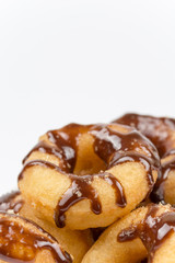 Macro view of chocolate donuts isolated on white