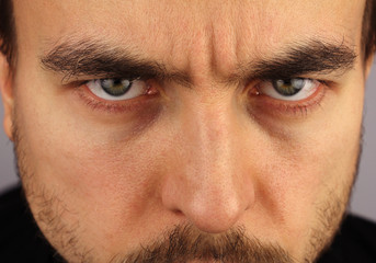 Fototapeta premium portrait of a man, menacing look, closeup