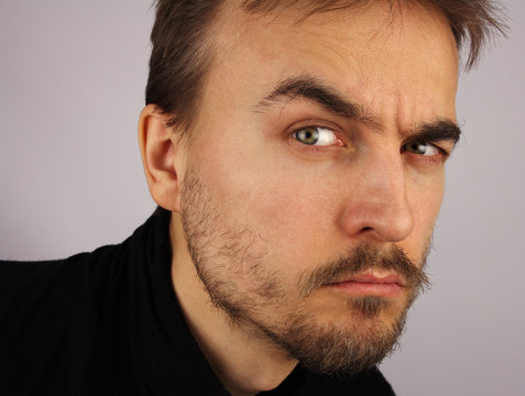 portrait of a man, suspicious look, closeup