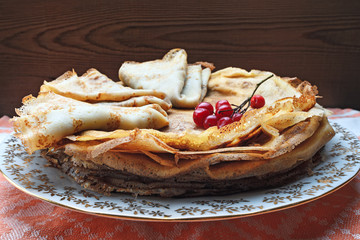 Sweet pancakes with berries viburnum.
