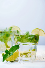 Cold fresh lemonade drink on a wooden background