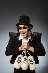 Funny man with dollar sacks