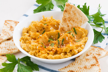 traditional sauce hummus with pita bread, closeup