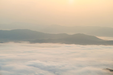 Fototapeta na wymiar Sunrise sky and misty layer mountain in the morning at sri nan national park thailand