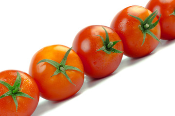 Tomatoes. Whole and a half isolated on white