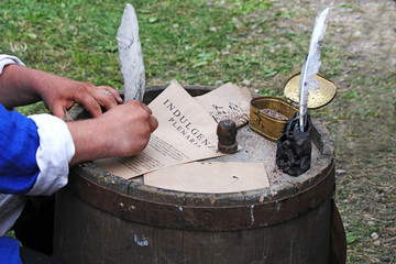the medieval clerk signs church indulgence