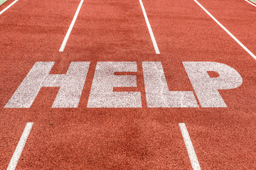 Help written on running track