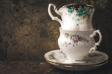 Old cup on metallic background