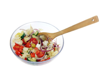 Fresh vegetable salad in transparent ware, isolated on the white