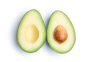 Two slices of avocado isolated on white background