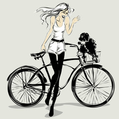 Fototapeta na wymiar Retro fashion girl with dog in a bicycle basket