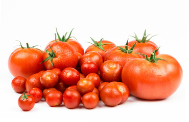 Tomatoes. Whole and a half isolated on white