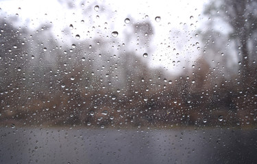 Naklejka na ściany i meble Rain drops on the car side mirror