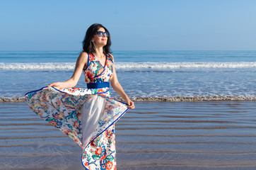 Young girl looking at the ocean and city