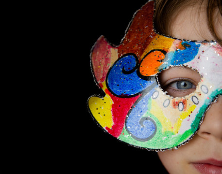 Boy wearing a multi-colored mask