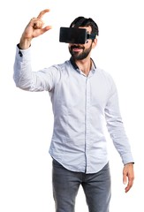 Man using VR glasses holding something