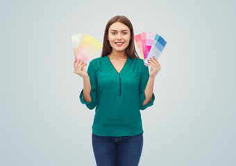 smiling young woman with color swatches