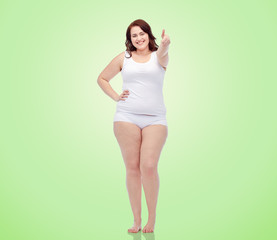 plus size woman in underwear showing thumbs up