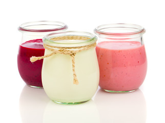 Delicious, nutritious and healthy yogurt in a glass jars on a wh