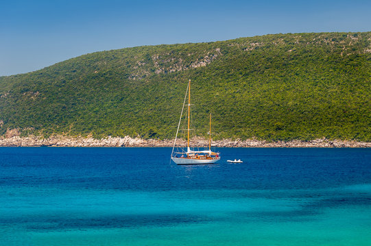 Sailing yacht at anchor in the beautiful Adriatic sea bay