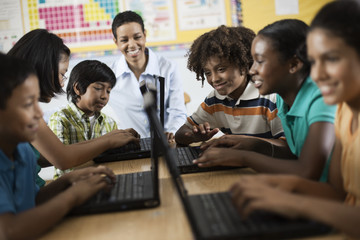 A group of students using laptops in a lesson, 