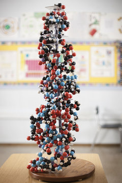 A tower of atoms bonded together in a scientific model in a classroom,