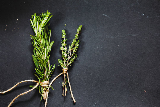 Rosemary And Thyme Bounds On A Dark Grey Board