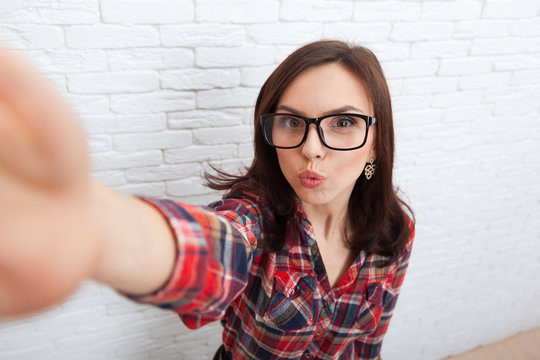 Young Beautiful Girl Taking Selfie Picture With Duck Face Lips Smart Phone Photo Camera