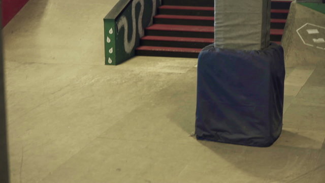 A guy on a skateboard to sliding on the rail