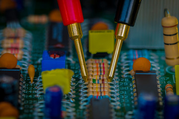 Fototapeta premium Multimeter,Resistors, electronic,Multimeter probes examining a resistors.