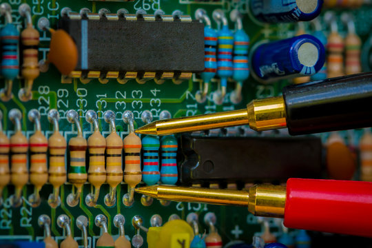 Multimeter,Resistor s, electronic,Multimet er probes examining a resistors.