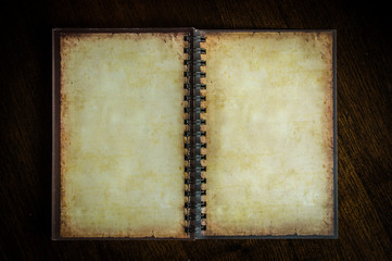 Vintage paper book with space on wooden background