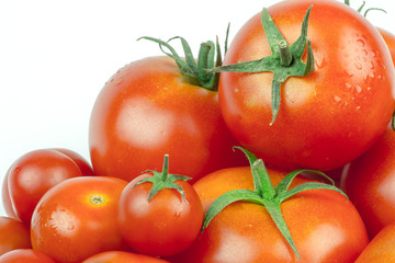 Tomatoes. Whole and a half isolated on white