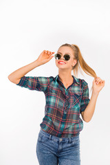 Naklejka premium Funny girl smiling and holding her glasses and long hair