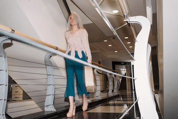 Young girl walking on the transition from a paper bag for shopping center