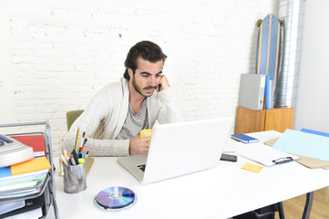 student preparing university project or hipster style freelancer businessman working with laptop