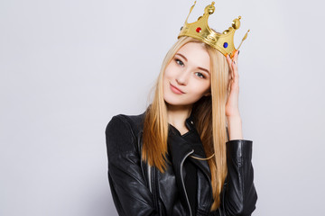 Gorgeous young girl wearing black jacket and crown