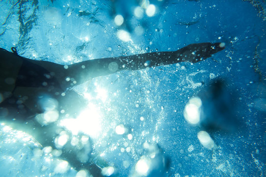 Woman Swimming Underwater