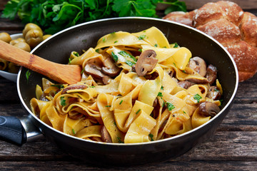 Pappardelle Pasta with mushrooms and other herbs in pan - obrazy, fototapety, plakaty