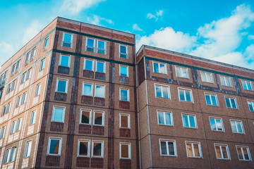 Fototapeta premium Flat brick apartment building with new windows