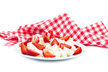 Strawberries in a cottage cheese in a bowl