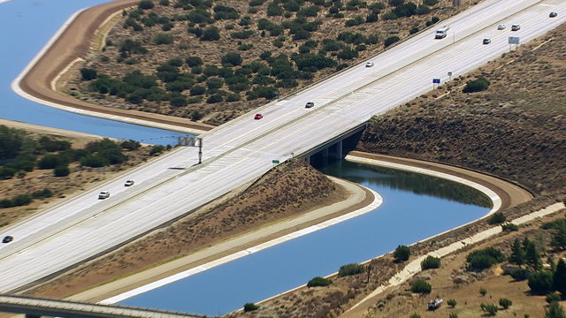 Aerial shot of aqueduct and freeway