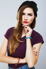 Lovely girl with red lips wearing shirt at gray background