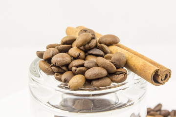 coffee beans, cinnamon on a white background
