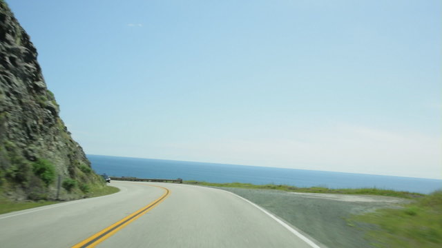 Vehicle point-of-view driving on California Highway 1 (aka Cabrillo Highway or Pacific Coast Highway) in the Big Sur area of Central California.