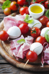 Fresh prosciutto with basil and mozzarella