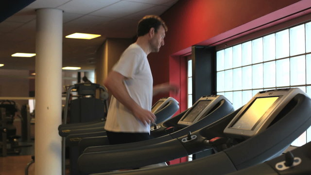 Man In the Gym: running on a treadmill