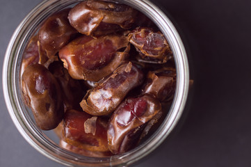 A lot of dates on black background, view from above