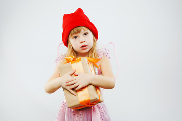 Concerned girl holding big present in her hands