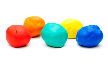 Colored plasticine on white background